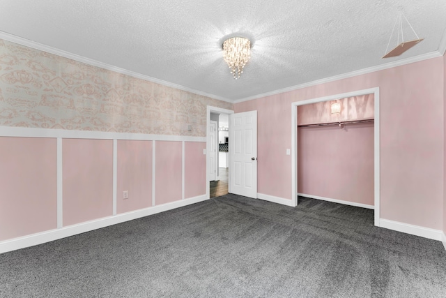 32 State Road F, Buffalo, MO 65622 - unfurnished bedroom with a textured ceiling, a closet, crown molding, dark carpet, and a chandelier
