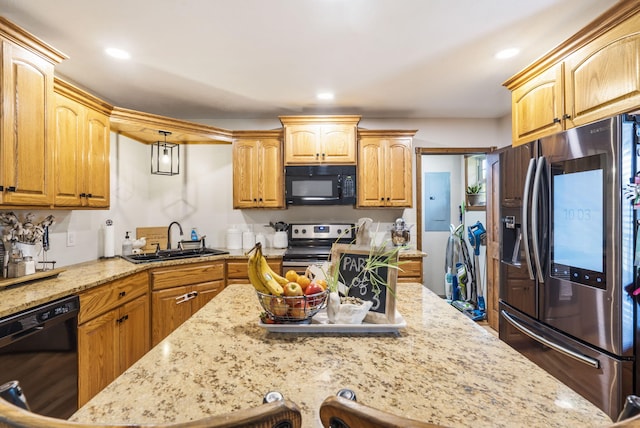 1427 W Missouri St, Buffalo, MO 65622 - kitchen featuring black appliances, a sink, light stone counters, and recessed lighting