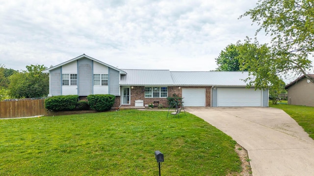 309 Webb St, Mountain View, MO 65548 - split level home featuring a garage, brick siding, concrete driveway, and metal roof