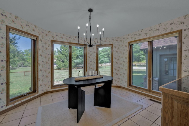 561 E Spring St, Neosho, MO 64850 - unfurnished dining area with wallpapered walls, light tile patterned flooring, a chandelier, and baseboards