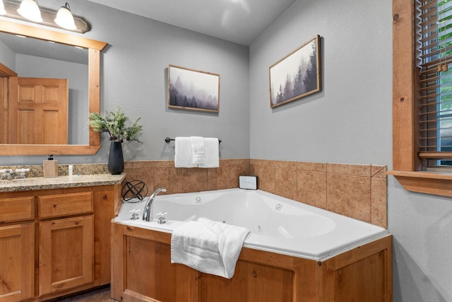 41 Stepping Stone Way Unit 55, Branson West, MO 65737 - bathroom featuring vanity and a jetted tub