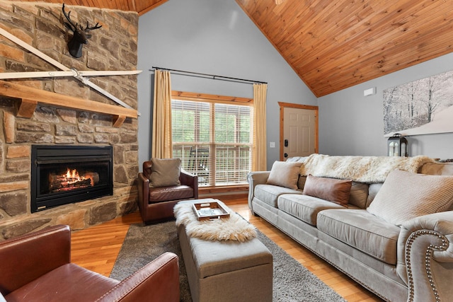 41 Stepping Stone Way Unit 55, Branson West, MO 65737 - living area featuring high vaulted ceiling, wood ceiling, wood finished floors, and a stone fireplace