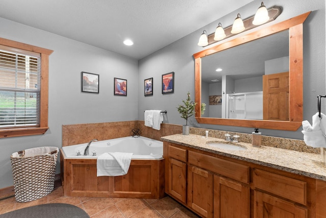41 Stepping Stone Way Unit 55, Branson West, MO 65737 - bathroom with vanity, a stall shower, a bath, and tile patterned floors