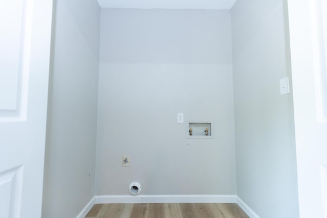 3218 W Countryside Dr, Springfield, MO 65807 - washroom with washer hookup, hookup for an electric dryer, light wood-type flooring, and baseboards