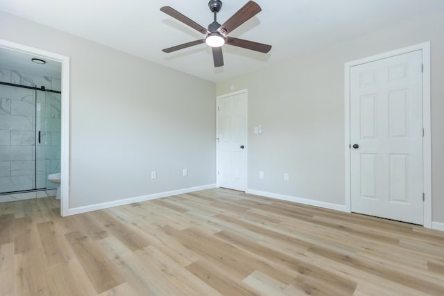 3218 W Countryside Dr, Springfield, MO 65807 - unfurnished bedroom with light wood-style floors, baseboards, connected bathroom, and a ceiling fan