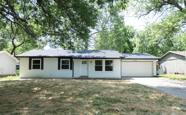 3218 W Countryside Dr, Springfield, MO 65807 - single story home featuring a garage, concrete driveway, and a front lawn