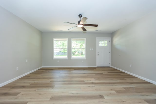 3218 W Countryside Dr, Springfield, MO 65807 - empty room with healthy amount of natural light, ceiling fan, baseboards, and light wood-type flooring