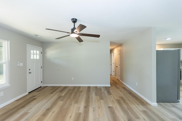 3218 W Countryside Dr, Springfield, MO 65807 - unfurnished living room with light wood finished floors, baseboards, ceiling fan, and recessed lighting