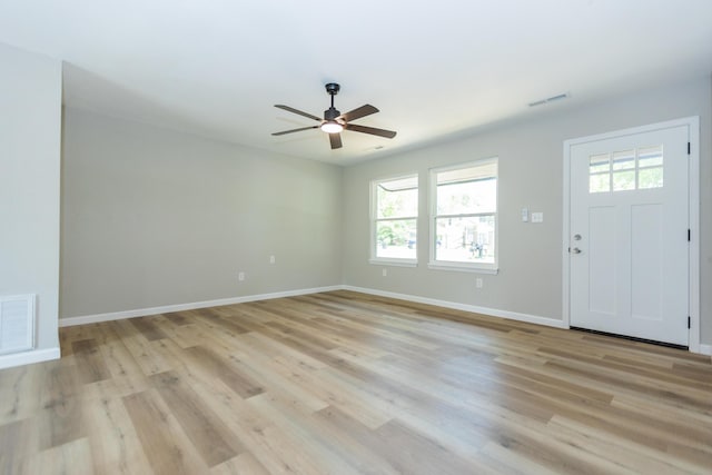 3218 W Countryside Dr, Springfield, MO 65807 - foyer with healthy amount of natural light, ceiling fan, baseboards, and light wood finished floors