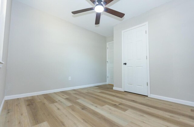 3218 W Countryside Dr, Springfield, MO 65807 - unfurnished bedroom featuring light wood-style flooring, baseboards, and a ceiling fan