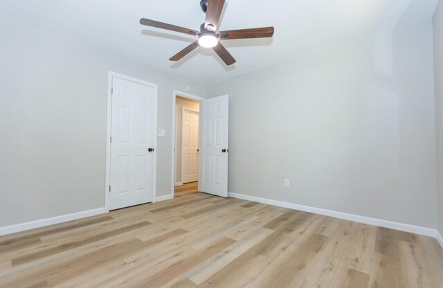 3218 W Countryside Dr, Springfield, MO 65807 - unfurnished bedroom with light wood finished floors, baseboards, and a ceiling fan