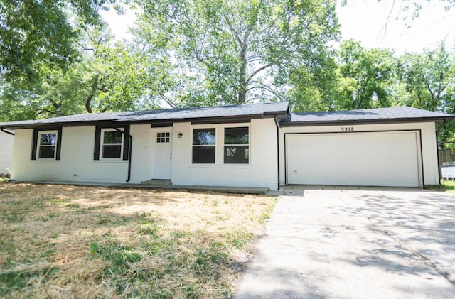 3218 W Countryside Dr, Springfield, MO 65807 - ranch-style house with an attached garage and concrete driveway