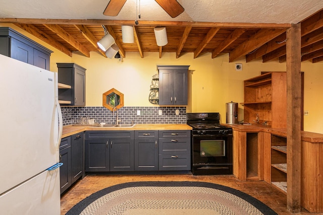 12234 Co Rd Unit 76-269, Ava, MO 65608 - kitchen featuring freestanding refrigerator, black gas stove, a sink, backsplash, and wood ceiling with exposed beams