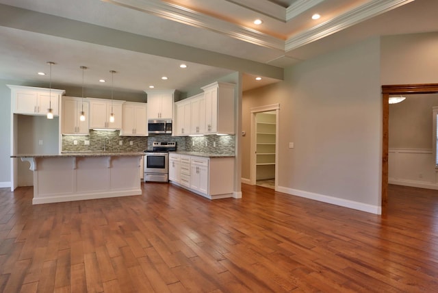 1189 N Cedar Ridge Ave, Springfield, MO 65802 - kitchen featuring stainless steel appliances, ornamental molding, backsplash, dark wood-style flooring, and white cabinets