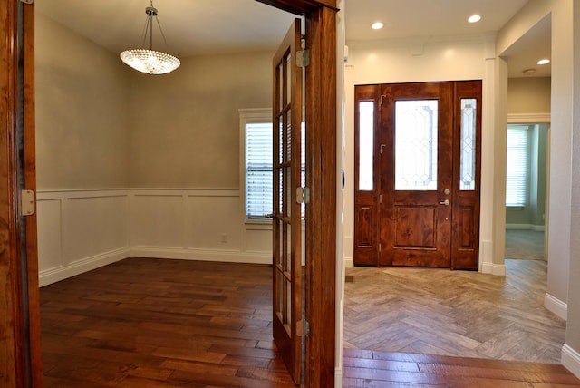 1189 N Cedar Ridge Ave, Springfield, MO 65802 - foyer entrance featuring healthy amount of natural light, wainscoting, recessed lighting, baseboards, and parquet floors
