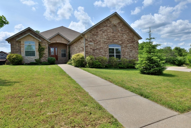 1189 N Cedar Ridge Ave, Springfield, MO 65802 - french country style house with a front yard and brick siding