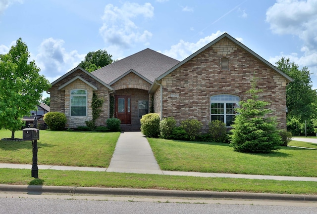 1189 N Cedar Ridge Ave, Springfield, MO 65802 - french country inspired facade with a front lawn and brick siding