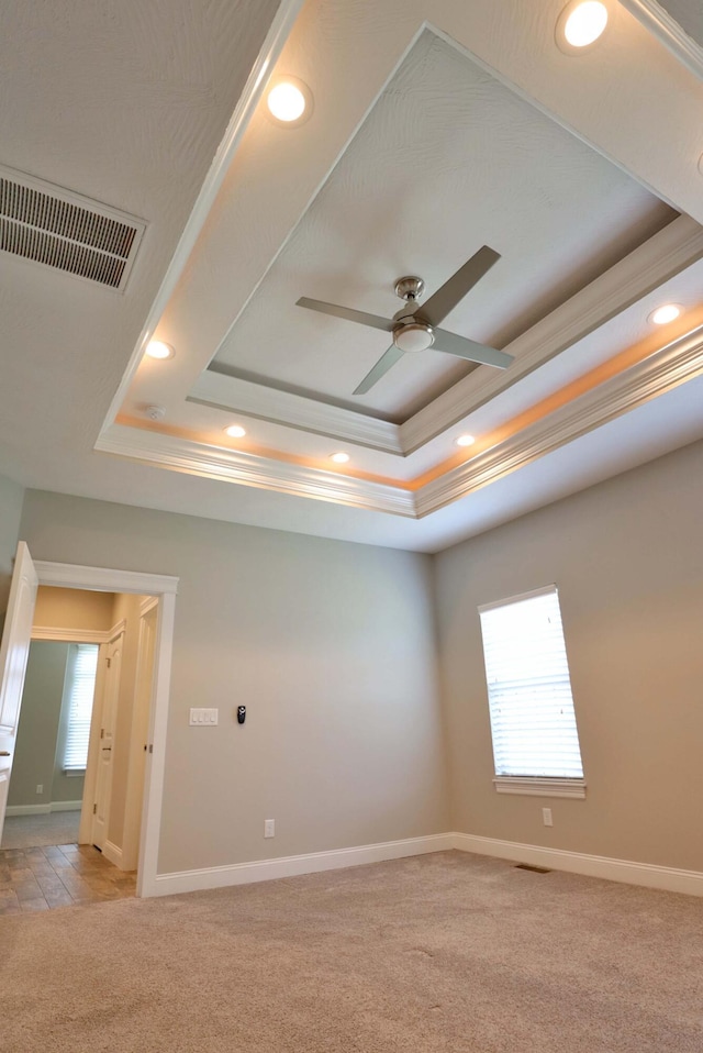 1189 N Cedar Ridge Ave, Springfield, MO 65802 - unfurnished room with light colored carpet, recessed lighting, a raised ceiling, ceiling fan, and baseboards
