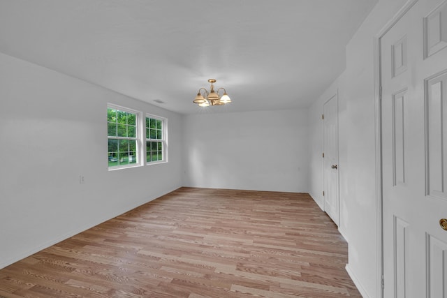 875-883 State Route T, West Plains, MO 65775 - empty room featuring a chandelier and light wood-type flooring