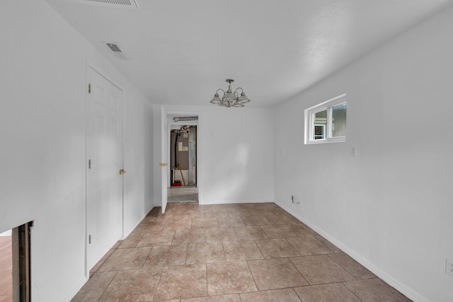 875-883 State Route T, West Plains, MO 65775 - unfurnished room featuring a chandelier and baseboards