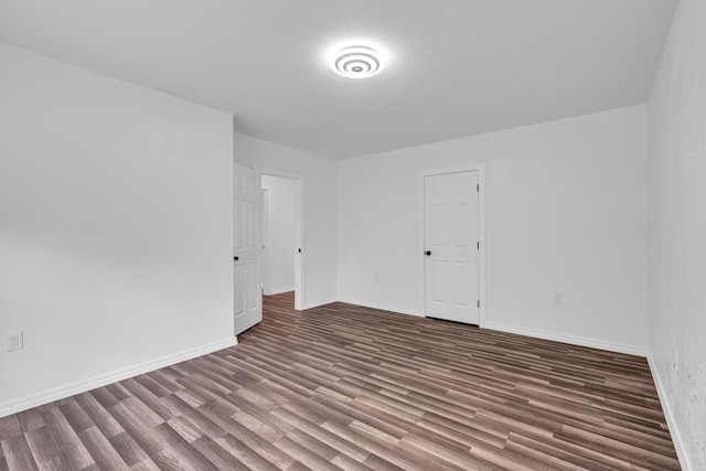 875-883 State Route T, West Plains, MO 65775 - empty room with wood finished floors and baseboards
