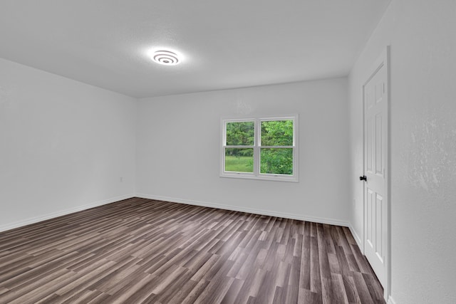 875-883 State Route T, West Plains, MO 65775 - unfurnished room with dark wood-style floors and baseboards