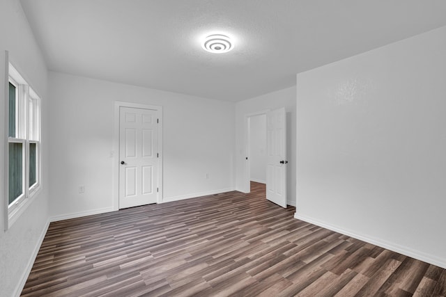875-883 State Route T, West Plains, MO 65775 - spare room featuring wood finished floors, baseboards, and a textured ceiling
