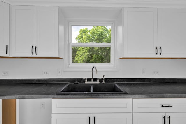 875-883 State Route T, West Plains, MO 65775 - kitchen with a sink, dark countertops, and white cabinetry
