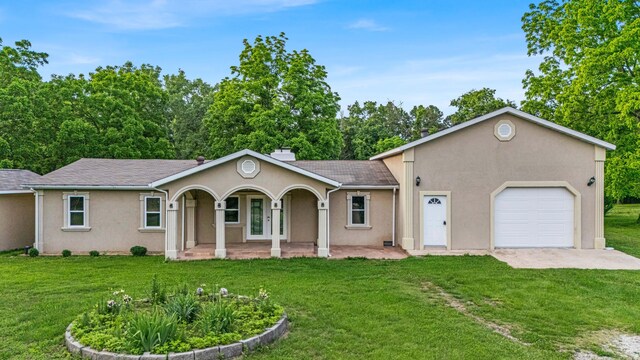 875-883 State Route T, West Plains, MO 65775 - ranch-style house featuring stucco siding, a front lawn, a porch, and a chimney