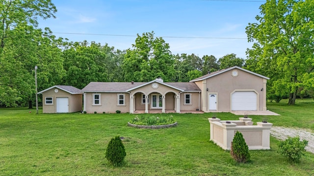 875-883 State Route T, West Plains, MO 65775 - single story home with stucco siding, a detached garage, a front lawn, and covered porch
