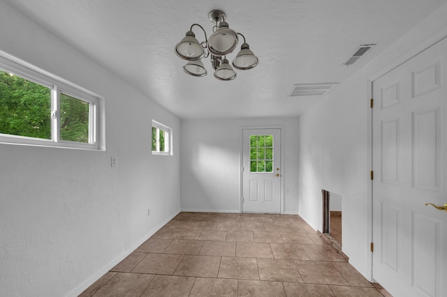 875-883 State Route T, West Plains, MO 65775 - foyer with a chandelier and baseboards