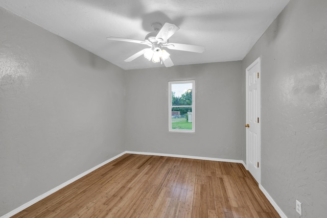 875-883 State Route T, West Plains, MO 65775 - empty room featuring wood-type flooring, baseboards, a ceiling fan, and a textured wall