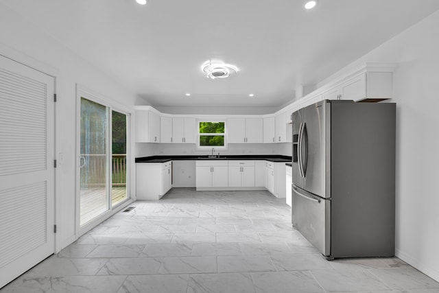 875-883 State Route T, West Plains, MO 65775 - kitchen featuring freestanding refrigerator, a sink, light marble finish flooring, recessed lighting, and white cabinets