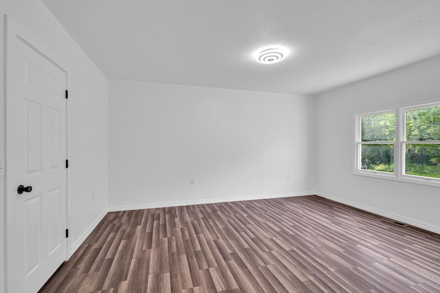 875-883 State Route T, West Plains, MO 65775 - unfurnished bedroom featuring dark wood-type flooring and baseboards