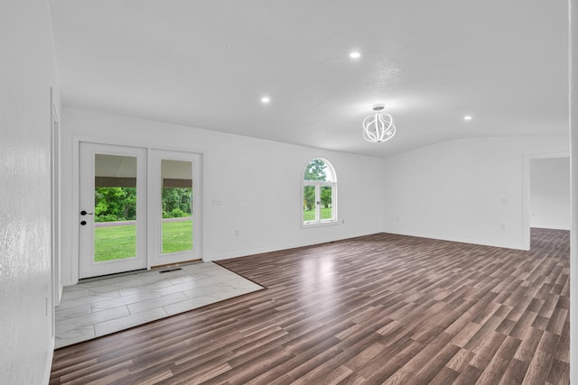 875-883 State Route T, West Plains, MO 65775 - unfurnished living room featuring wood finished floors, recessed lighting, lofted ceiling, and baseboards