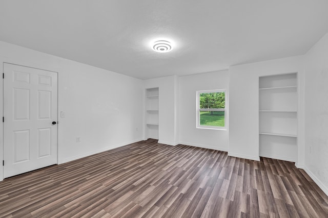 875-883 State Route T, West Plains, MO 65775 - unfurnished bedroom featuring dark wood-style floors, baseboards, and a textured ceiling