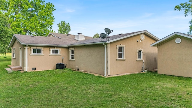 875-883 State Route T, West Plains, MO 65775 - rear view of property with stucco siding and a lawn