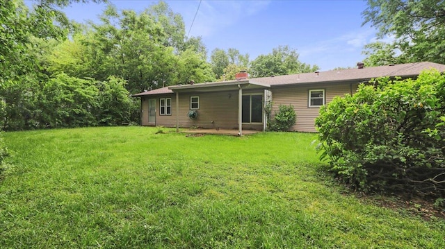 619 E Mcgee St Lot 15, Springfield, MO 65807 - rear view of property with a yard and a chimney