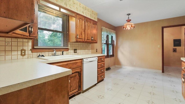 619 E Mcgee St Lot 15, Springfield, MO 65807 - kitchen featuring dishwasher, healthy amount of natural light, light countertops, and brown cabinetry
