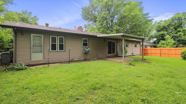 619 E Mcgee St Lot 15, Springfield, MO 65807 - rear view of house with a chimney, central AC, and a patio area