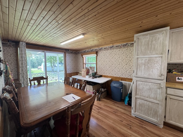 10623 State Highway O, Ava, MO 65608 - dining room with wallpapered walls, a wainscoted wall, light wood-type flooring, wooden ceiling, and wood walls