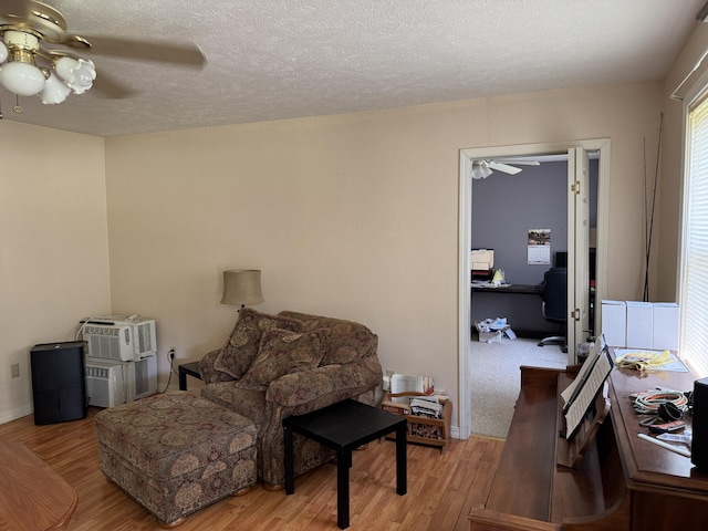 10623 State Highway O, Ava, MO 65608 - sitting room featuring a ceiling fan, a desk, wood finished floors, and a textured ceiling