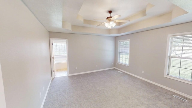 780 S Timber Ridge Dr, Nixa, MO 65714 - carpeted empty room featuring a ceiling fan, a tray ceiling, and baseboards