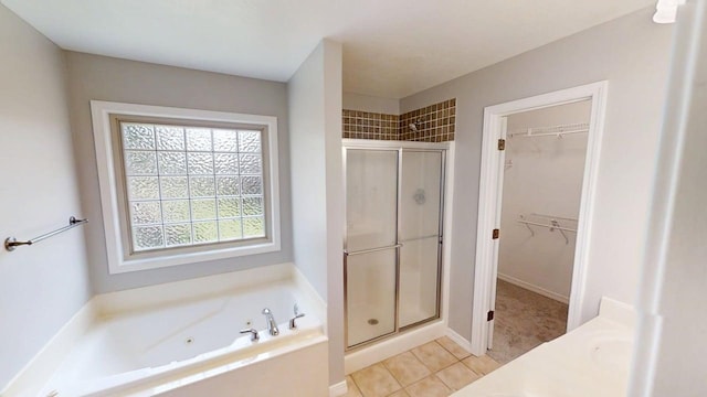 780 S Timber Ridge Dr, Nixa, MO 65714 - full bath with a shower stall, a tub with jets, a spacious closet, and tile patterned flooring