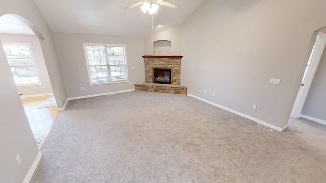780 S Timber Ridge Dr, Nixa, MO 65714 - unfurnished living room with a ceiling fan, plenty of natural light, lofted ceiling, arched walkways, and baseboards
