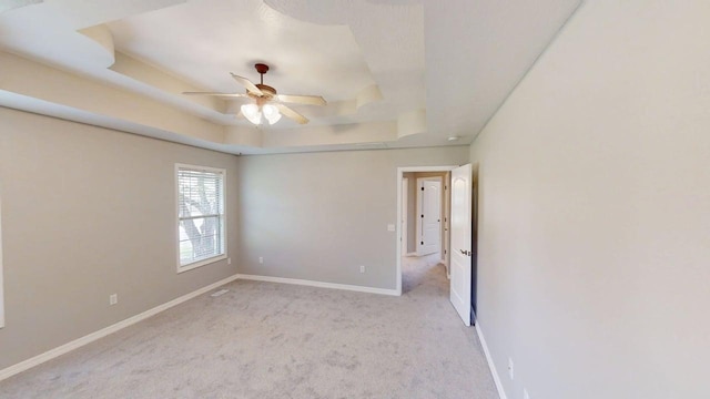 780 S Timber Ridge Dr, Nixa, MO 65714 - spare room with a raised ceiling, carpet flooring, ceiling fan, and baseboards