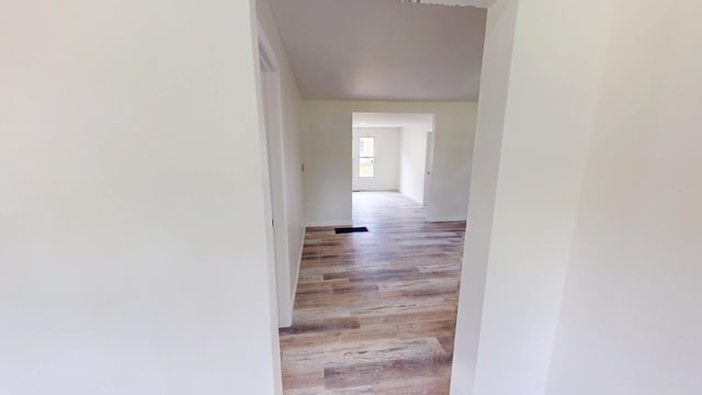 627 W Cherry St, Nevada, MO 64772 - hall featuring light wood finished floors and baseboards