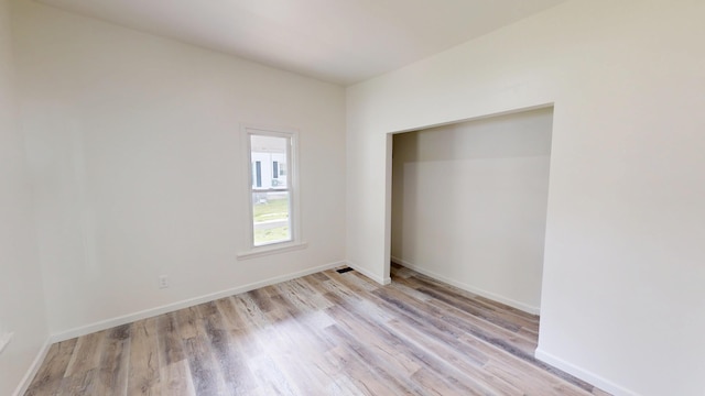 627 W Cherry St, Nevada, MO 64772 - unfurnished bedroom featuring light wood-type flooring and baseboards