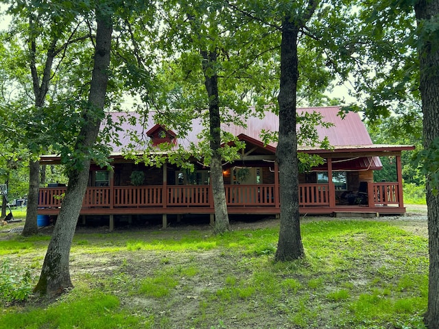 1501 NE 775th Rd, Osceola, MO 64776 - rear view of property with metal roof and a deck