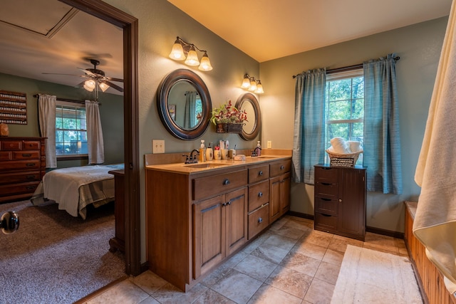1501 NE 775th Rd, Osceola, MO 64776 - ensuite bathroom with double vanity, a ceiling fan, baseboards, and tile patterned flooring